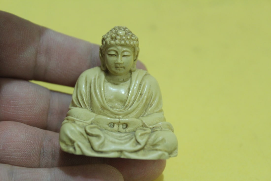 A Japanese Carved Resin God Figurine: 2" tall- very detailed
