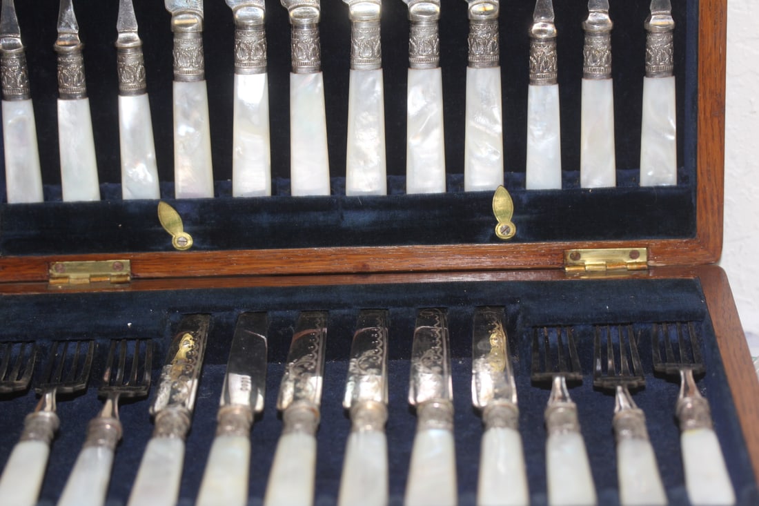 Set of 24 Sterling Band Flatware Set: mother of pearl and sterling band - fitted inside an original wood box - please note: box has no key - box measuress at 11 3/4" x 8 3/4"
