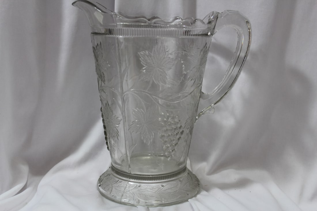 A Pressed Glass Pitcher: 9" tall