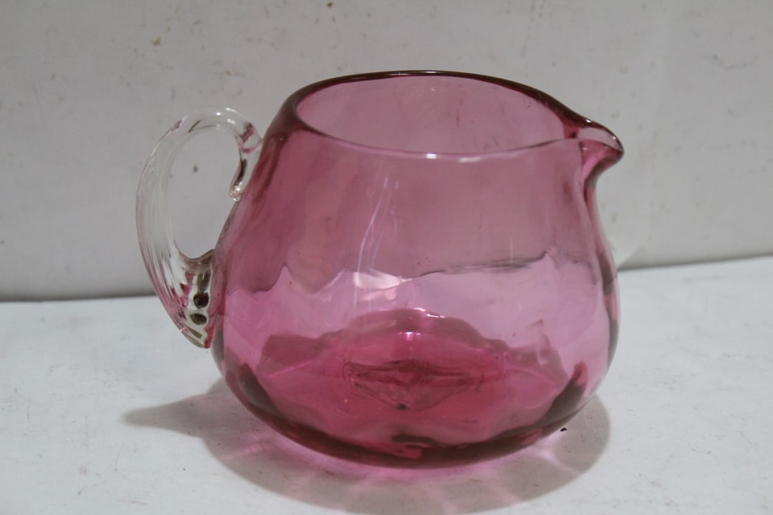 A Cranberry Glass Creamer: 3 1/4" tall