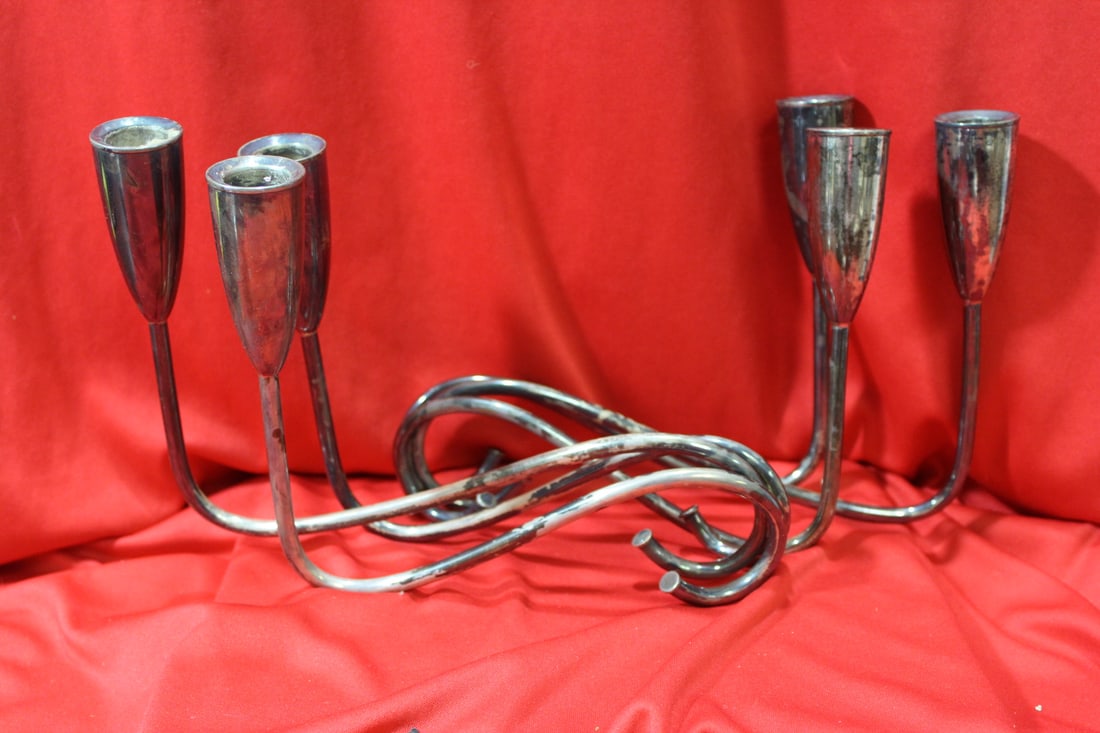 A Pair of Weighted Sterling Candlesticks: approximately 7 inches tall