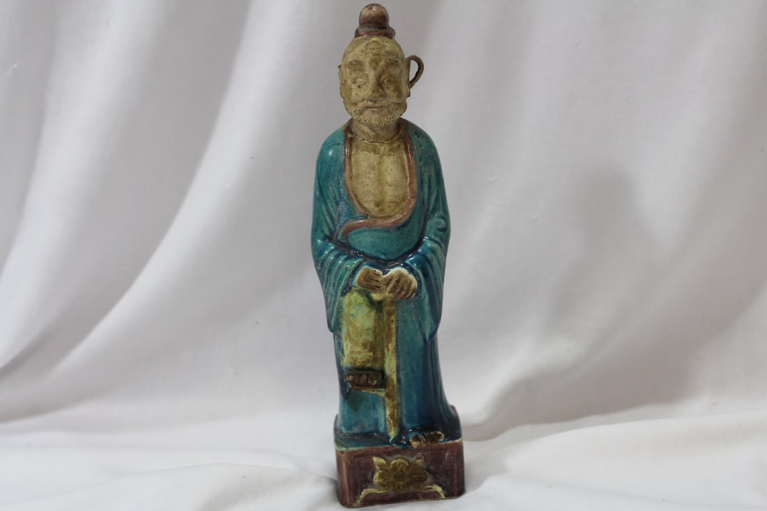 An Antique Chinese Clay Figurine: please note: missing and losses - head glued back - 9" tall