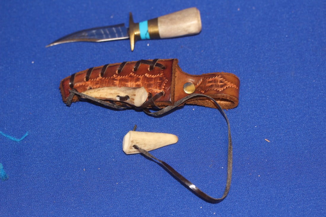 An Anza? Knife with Lether Sheath: knife only= 3 3/4" across