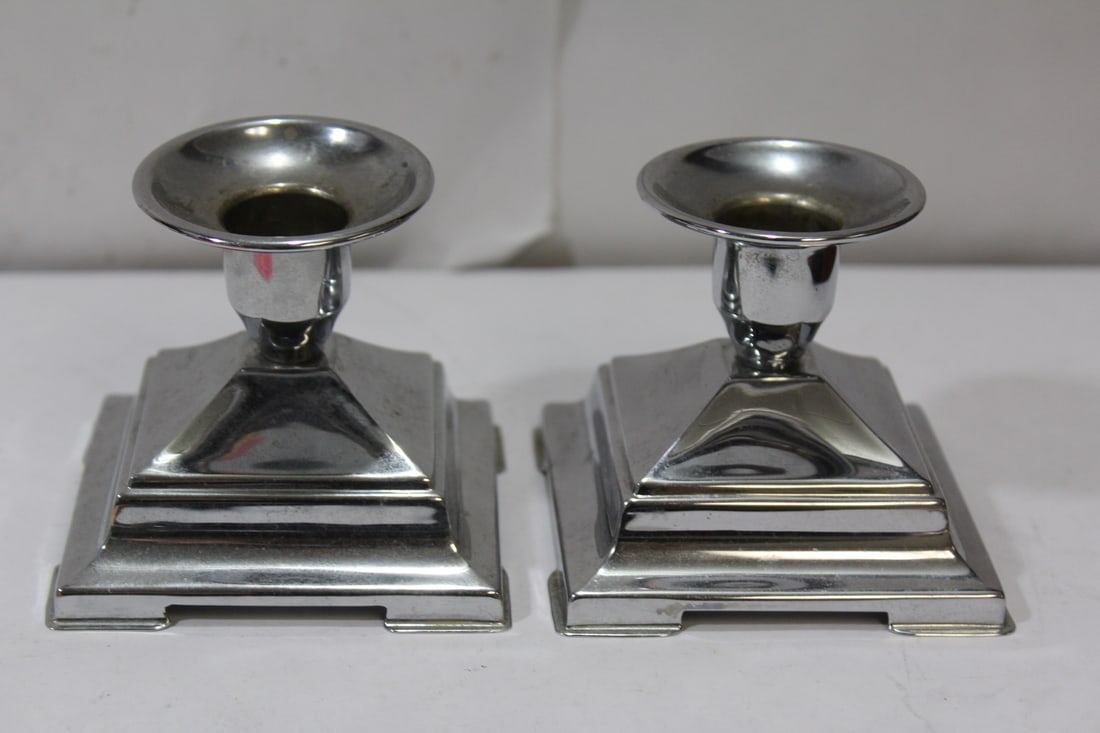A Pair of Silverplated Candlesticks: 2 3/4" tall