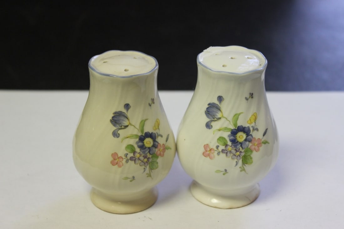 A Pair Of Salt And Pepper Shaker: Please note a small chip on the base - 3 1/4 inches tall