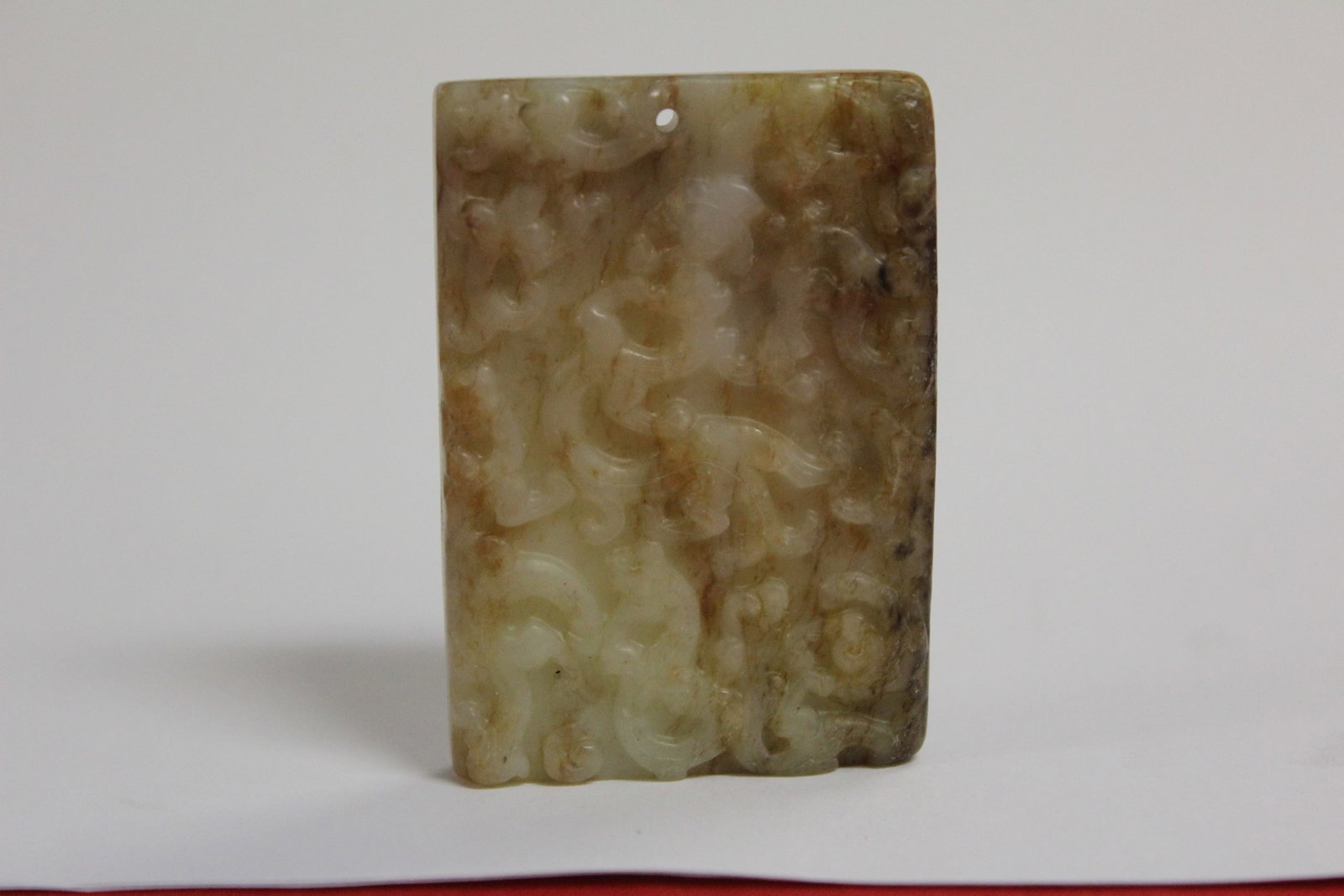 A Russet Jade Plaque: 2 3/4" x 1 3/4" as a pendant