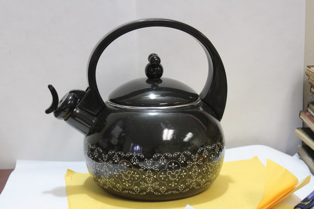 A Disney's Mickey Mouse Enamel Teapot: 9" tall