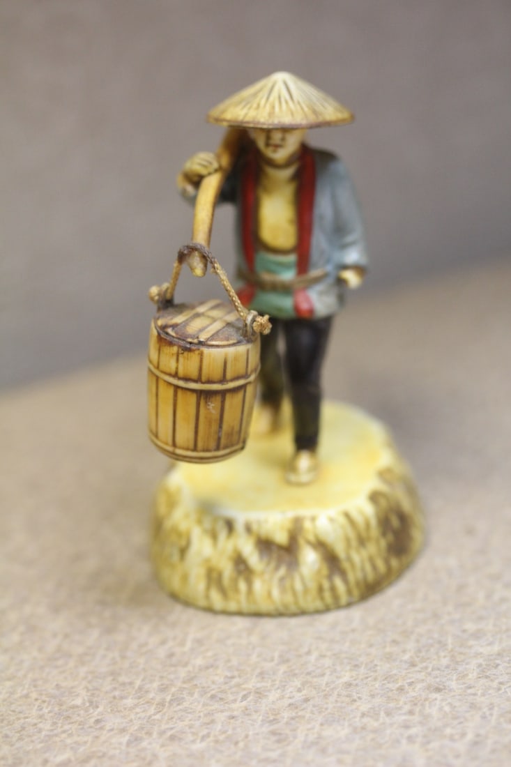 Vintage Japanese Celluloid Man: with swinging barrell - 3 inches across