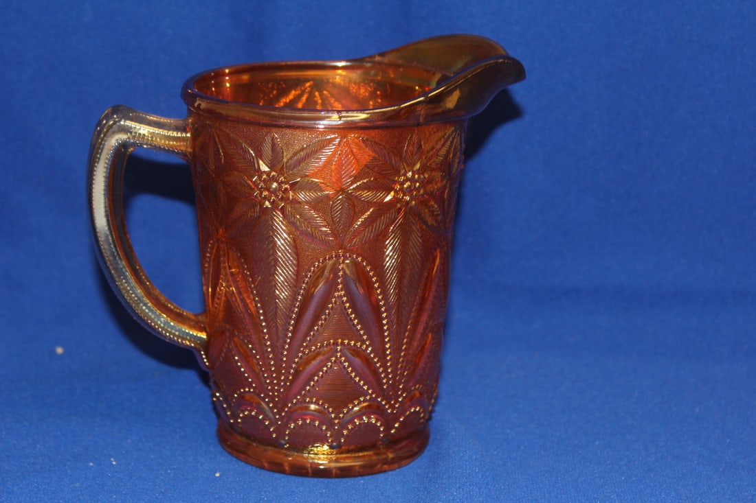 A Carnival Glass Pitcher: Imperial Glass company - Poinsetta pattern - 6 1/4" tall