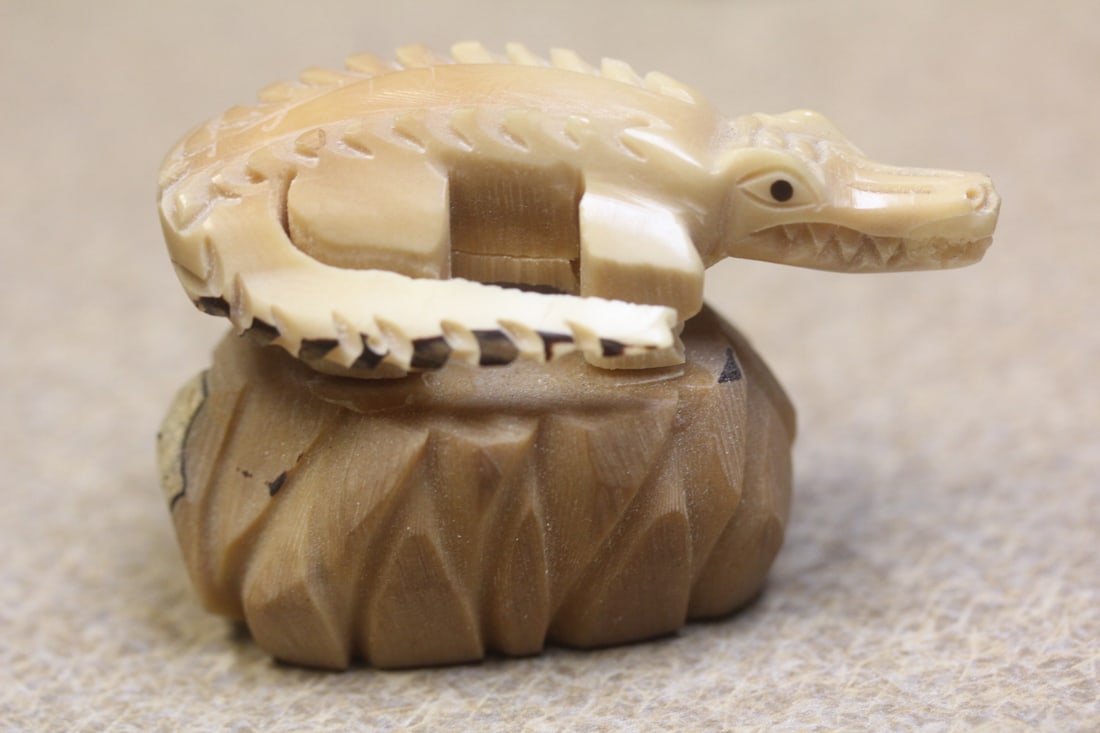 Taqua Nut Carving of an Alligator: on rock - 2 3/8" wide