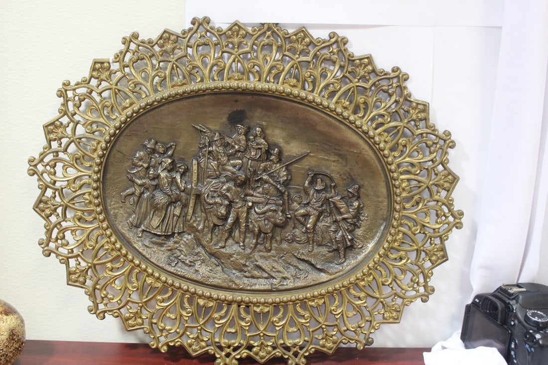 A Framed Bronze Plaque: the plaque most likely 19th century, high relief carved - overall= 19 5/8" in diameter - plaque= 13" in diameter