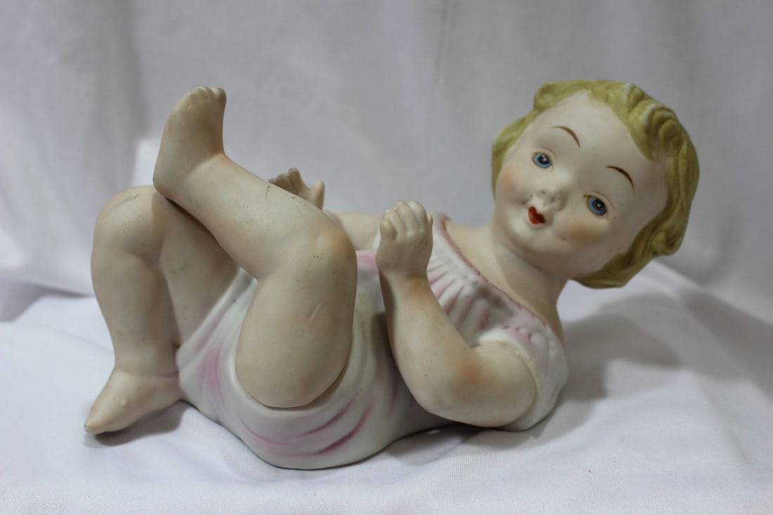 A Bisque Doll: 8" across