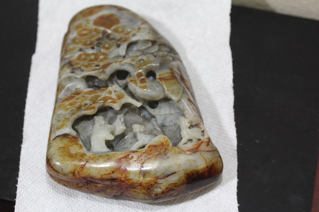 A Carved Jade Boulder: Nephrite Jade with Russet skin - longest= 6 1/4 inches