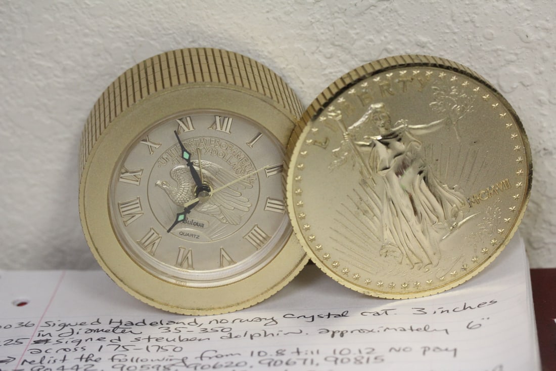 Bulova Coin Stacking Clock: runs - new battery - please note: battery cover missing - 3 3/8" in diameter