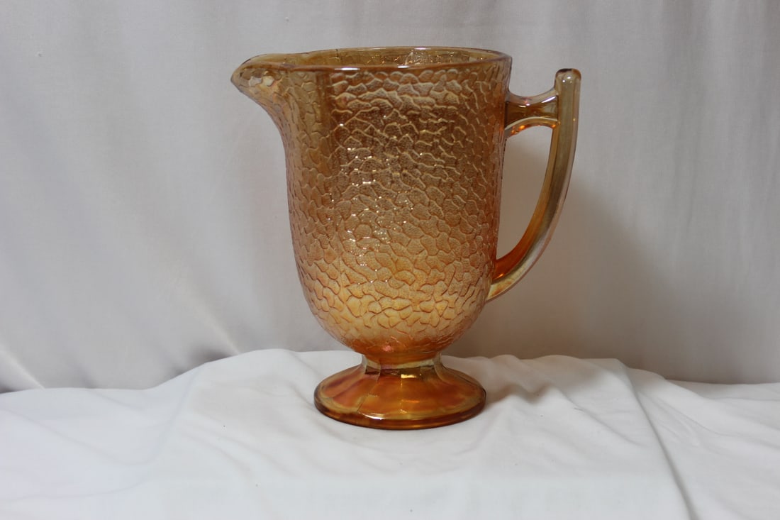 A Carnival Glass Pitcher: 8 1/8" tall