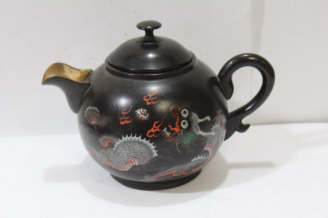 A Japanese or Chinese Lacquer Teapot: please note: lid stuck to the opening - 5 3/4" across - possibly a rare piece