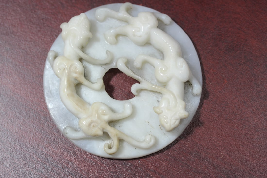 A Chinese White Jade Chilung Disc: 3 3/4" in diameter