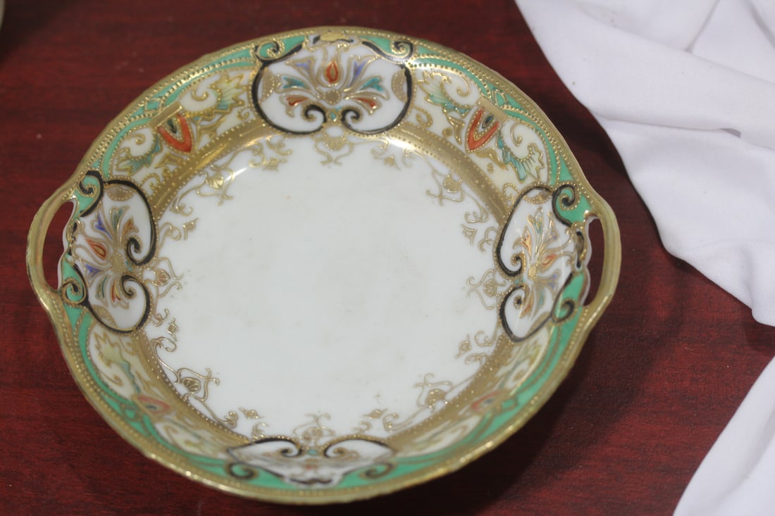 A Two Handle Japanese Bowl: please note: one small craze underside, that does not go through to the other side, as shown -6 1/2" across, from handle to handle