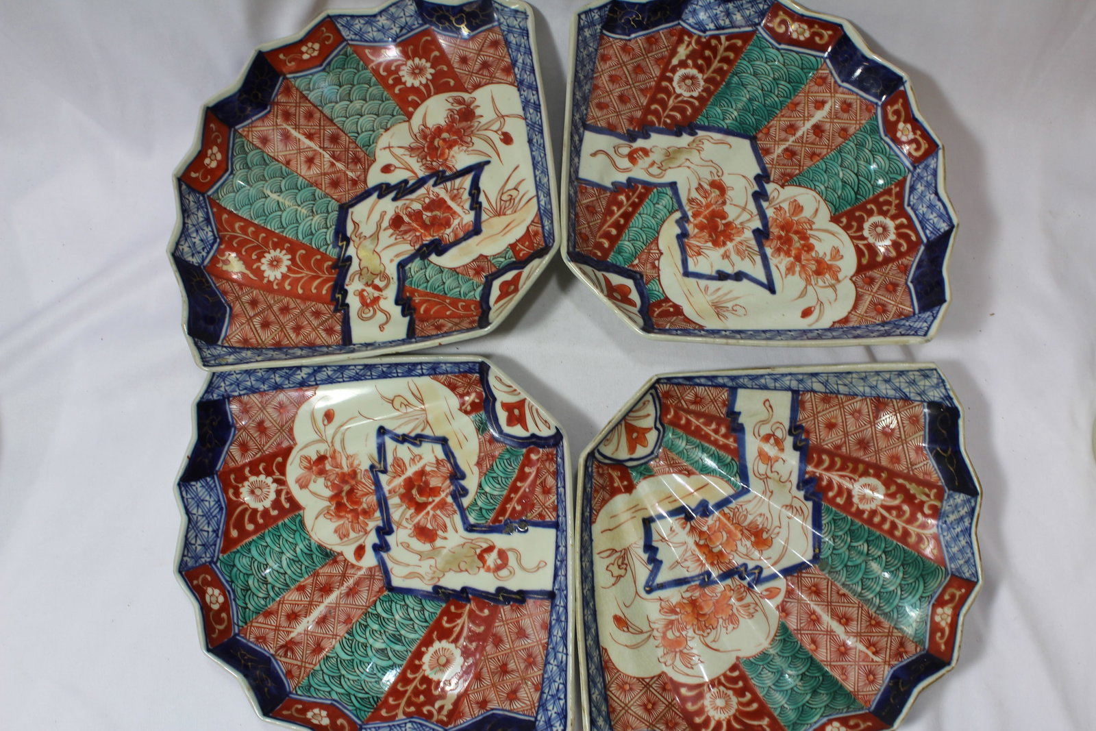 Set of 4 Fan Shape Japanese Imari Plates: 19th century - rare - 9 3/4" in diameter each - please note: worn