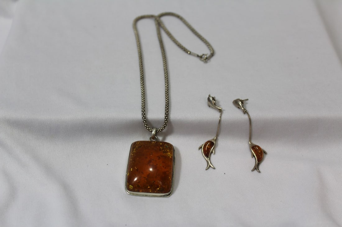 A Necklace with Amber Pendant and Earrings Suite: necklace= 9" long - pendant= 2 1/4" long, including bail - most likely baltic amber