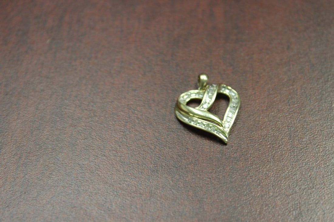 A 10Kt Gold and Diamond Pendant: marked