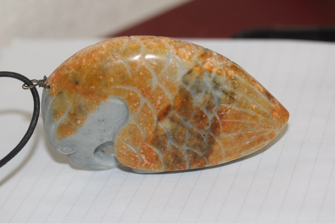 Chinese Nephrite Jade Pendant: Jade or similar hardstone - eagle motief - with russet design - 3 5/8" across