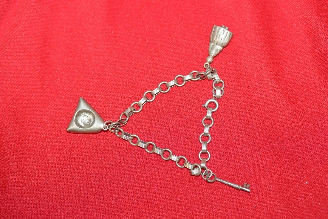 A Sterling Charm Bracelet: as shown