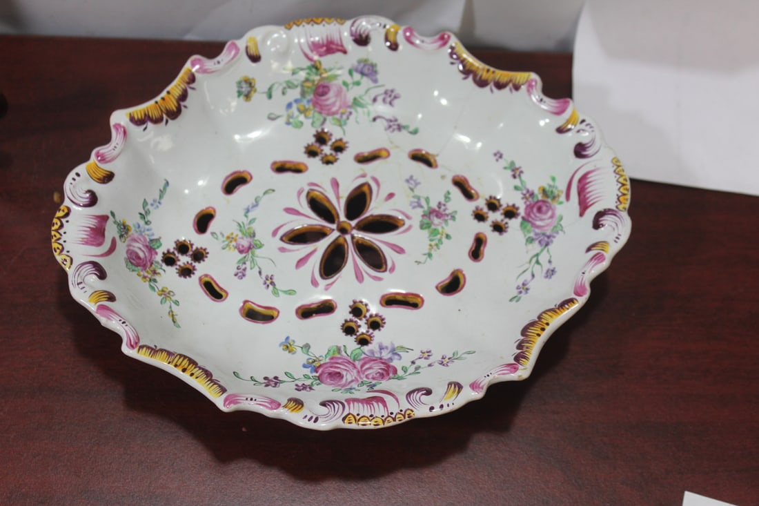 An Antique Ceramic Footed Platter: please note: staple repaired - 9 1/2" in diameter
