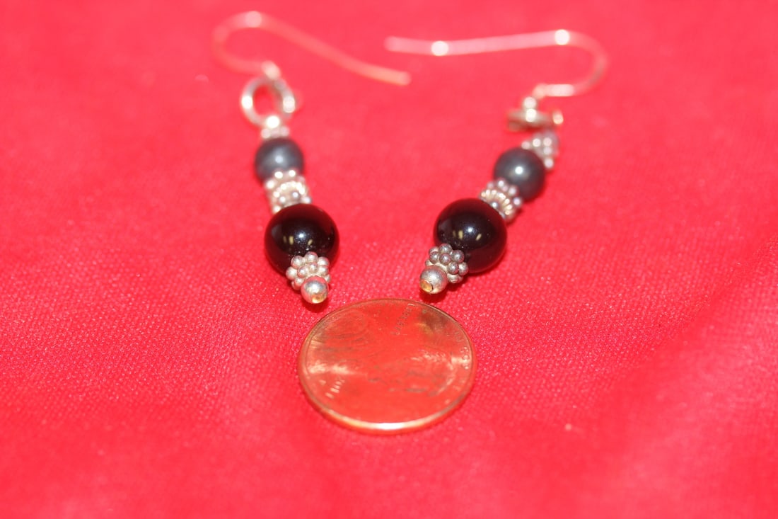 A Pair of Sterling Earrings: as shown