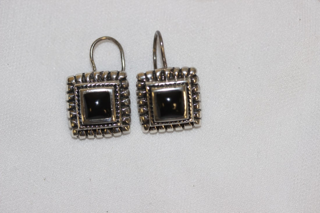 A Pair of Sterling Earrings: as shown