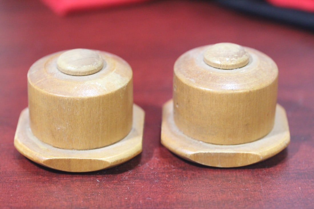 A Pair of Wooden Salt and Pepper Shakers: 1 7/8" across