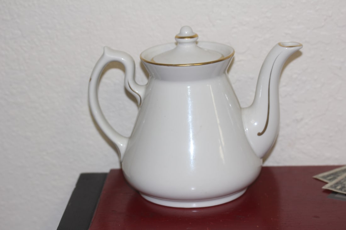 Hall Teapot: 6 inches tall by 7 1/4" wide