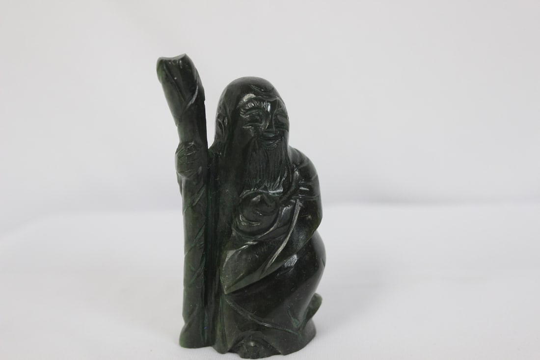 A Spinach Jade Figurine: 3 1/4" tall