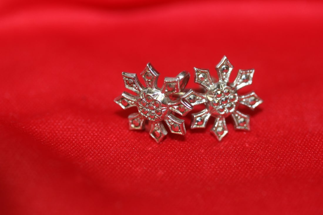 A Pair of Sterling Earrings: as shown