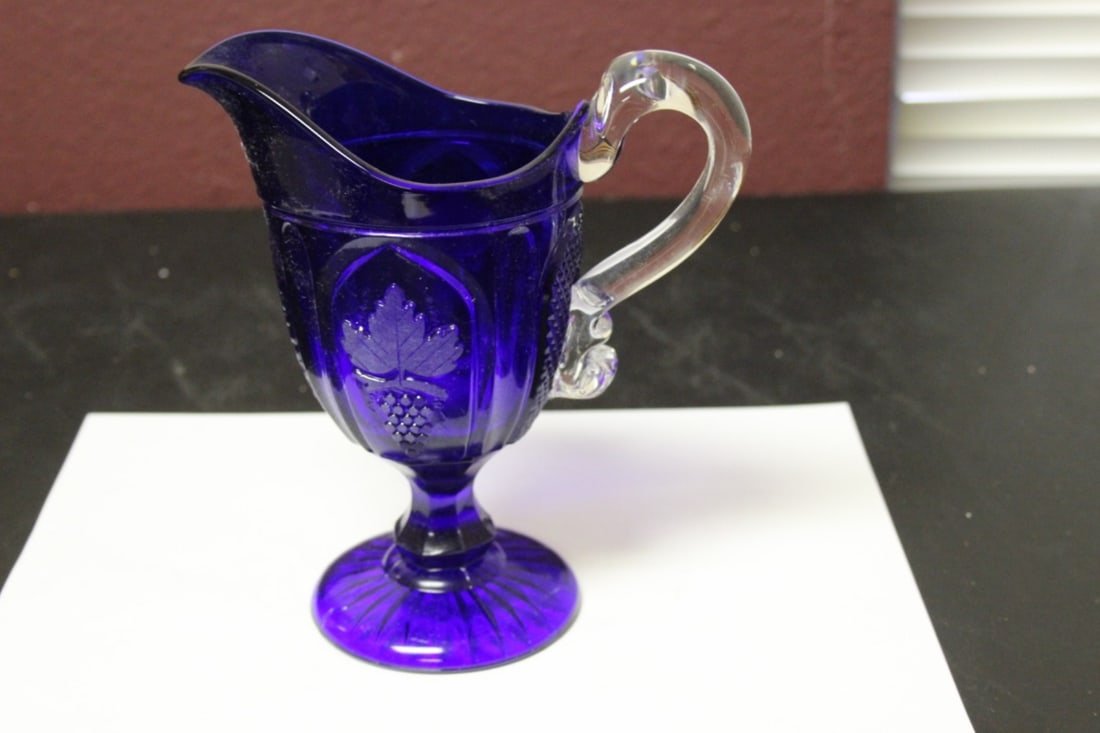 A Blue Glass Pitcher: 7" tall