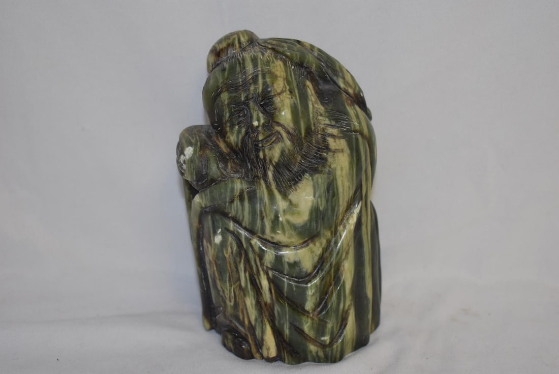 A Jade or Similar Hardstone Sage: please note: scratches - 5 3/4" tall