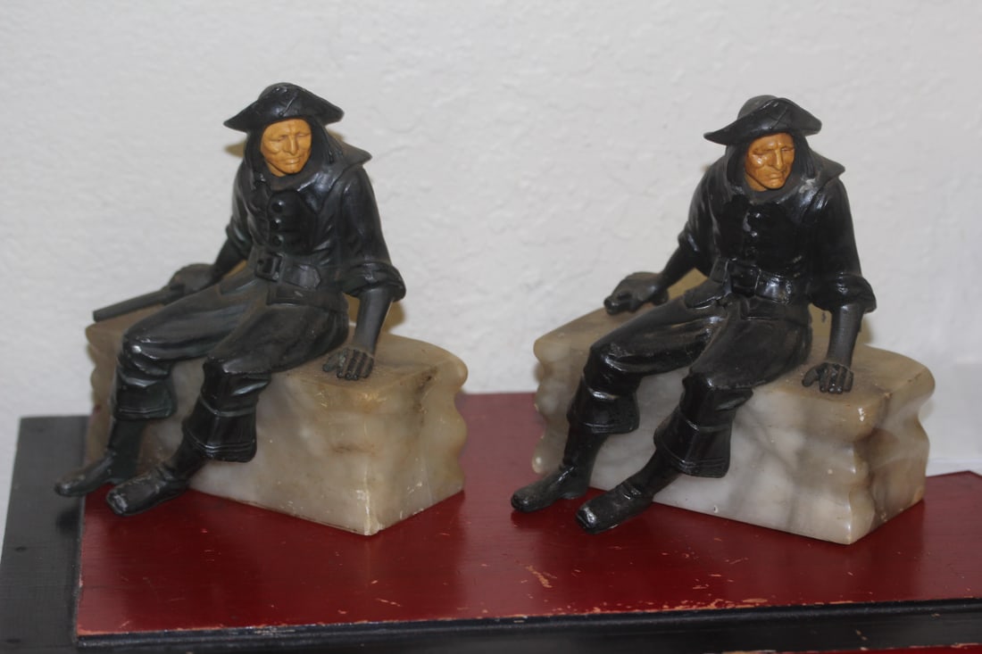 Pair of Paul Herzl Sailor Bookends: please note: one of the rifle may have chamber broken off - face appeared to be bakelite - Deco era - marble base - 6 3/8" tall by 5 1/4" wide