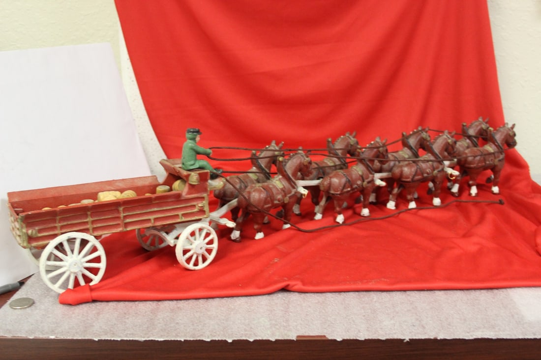 A Cast Iron Horse and Buggy with Wheelbarrows: approximately 30 inches long
