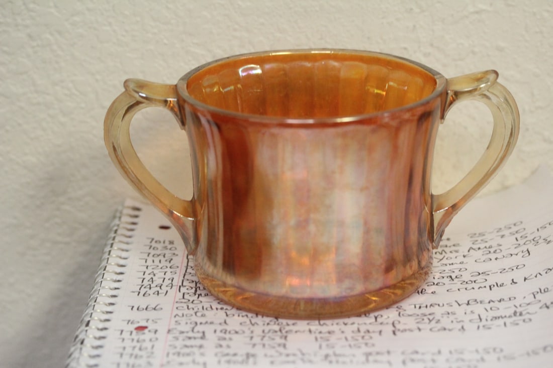 Carnival Glass Cup: two handle - handle to handle measure" 6 3/4" in diameter