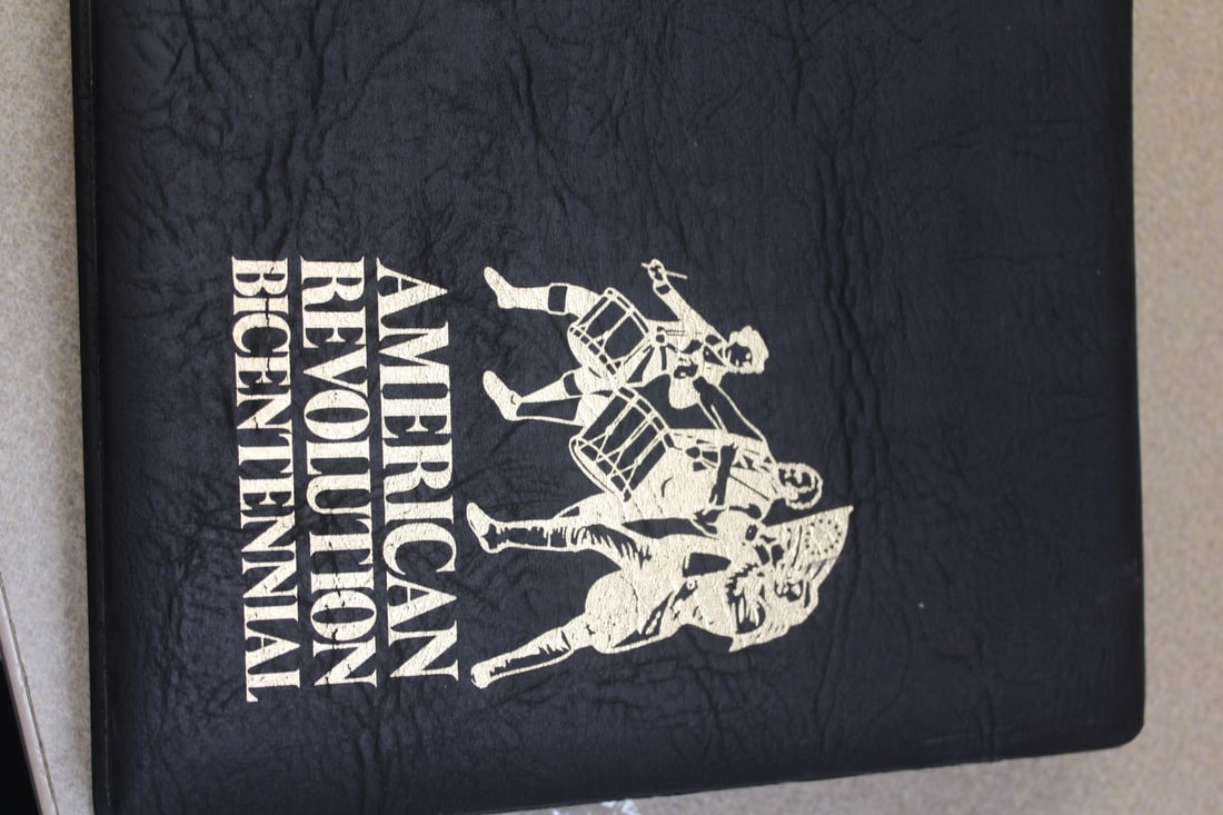 American Revolution Bicentennial Stamped Sheets: inside a binder