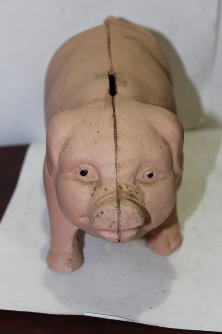A Cast Iron Pig Bank: 7 3/4" across