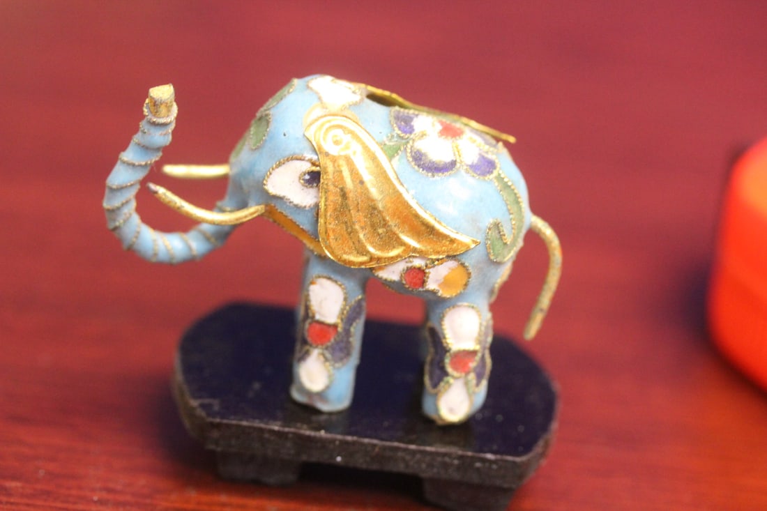 A Cloisonne Elephant on Stand: 2 inches across