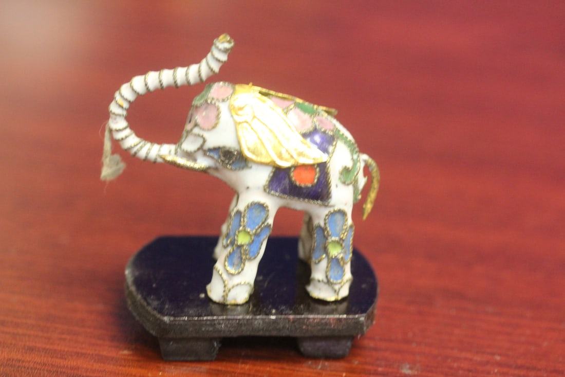 A Cloisonne Elephant on Stand: 2 inches across