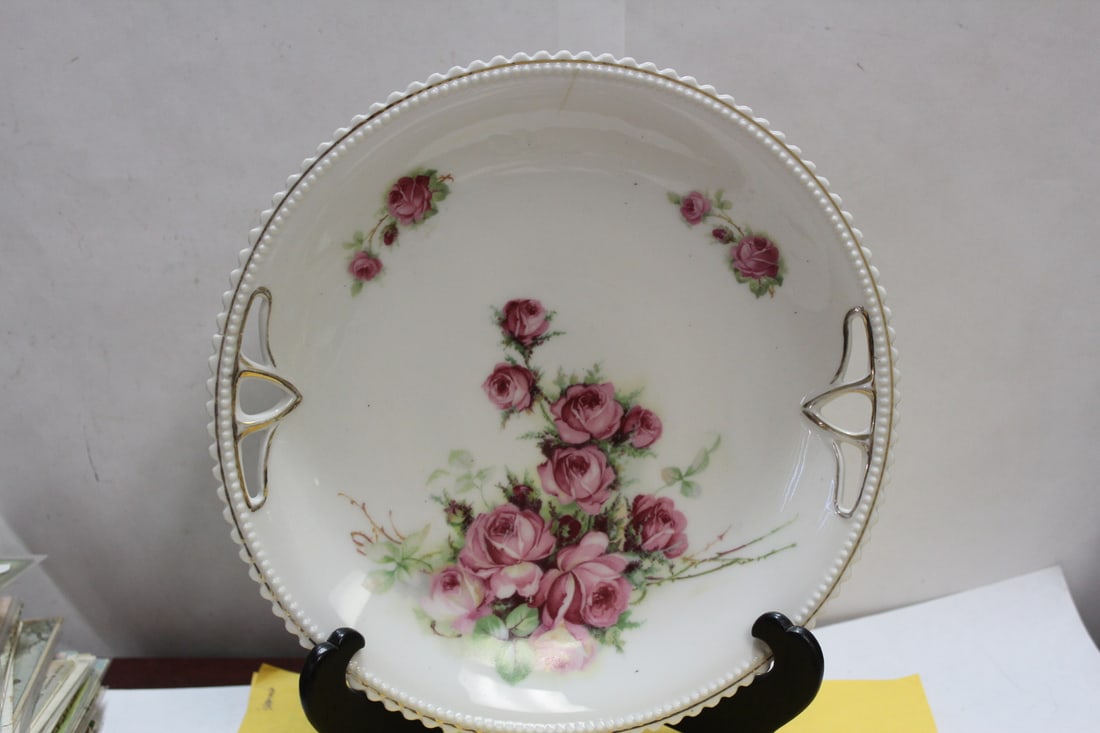 An Antique Silesia Rose Plate: with two handles - please note: faint hairline as shown - 9 3/4" in diameter - nice looking plate