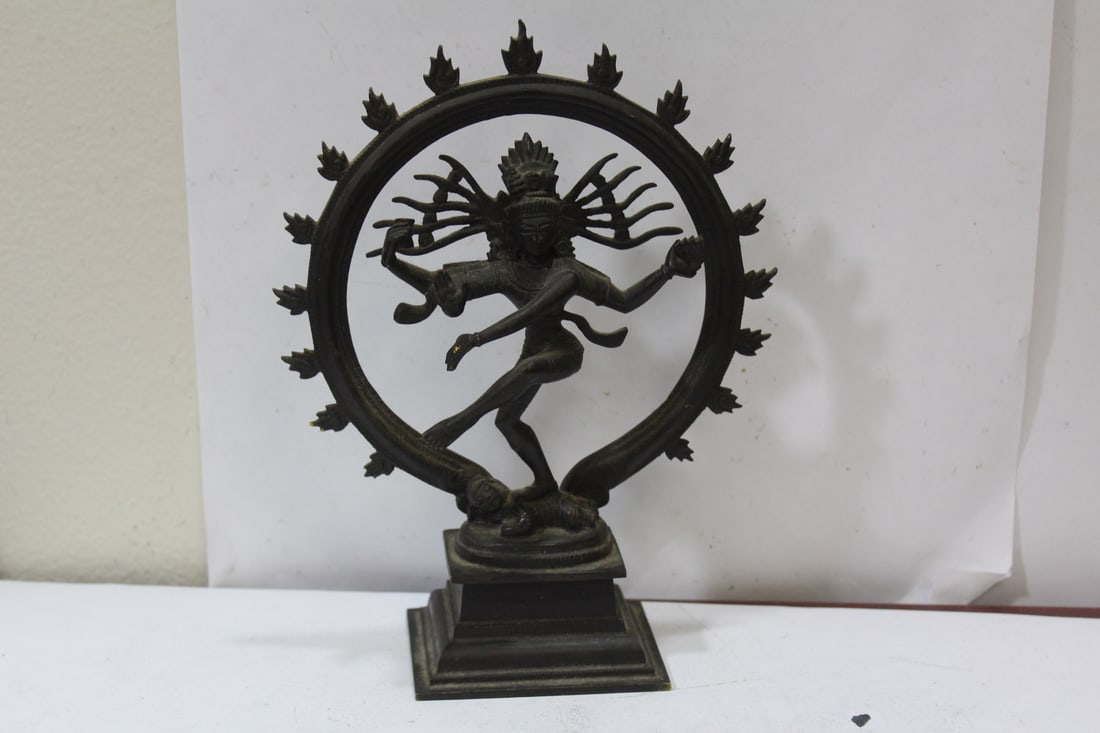An Oriental Metal God: possibly bronze - 8" tall