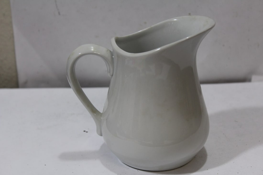 A Ceramic Creamer: 4 5/8" tall