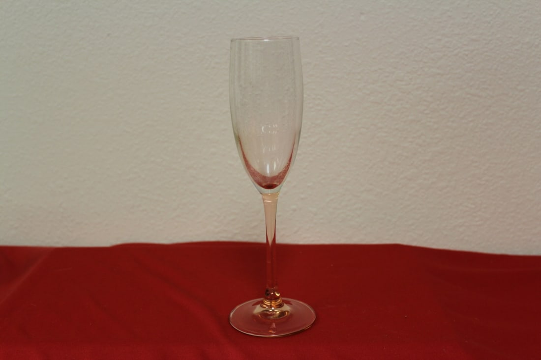 A Pink Glass Champagne Glass: marked: France - 9" tall