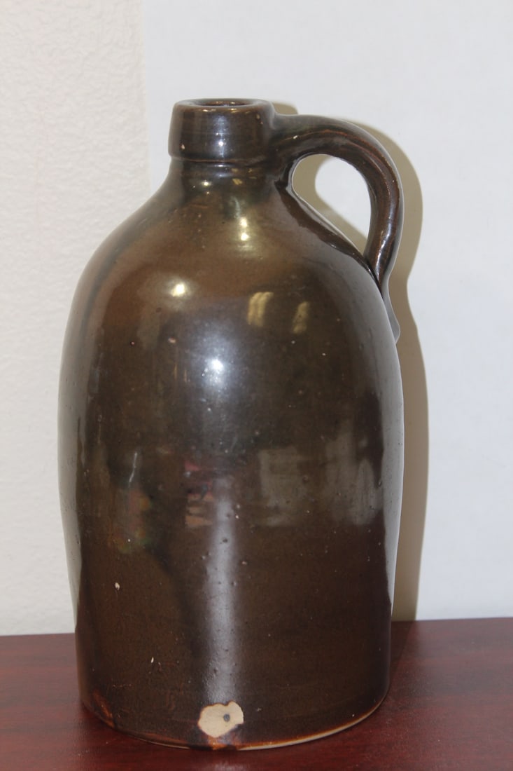 An Antique/Vintage Stoneware Jug: please note: chip as shown - 9 1/4" tall - most likely 19th century