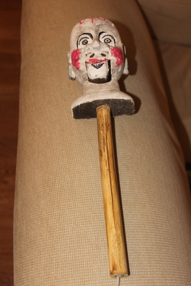 Wooden Chinese Puppet: with a bamboo stick - you pull the string and the mouth moves - may have something to do with the chinese Olympic - 15 inches tall