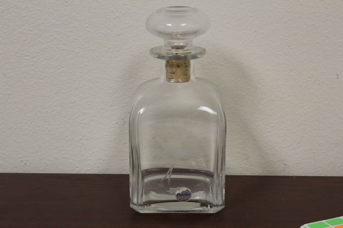 A Vintage Kosta Crystal Etched Decanter: signed and labeled - 8" tall